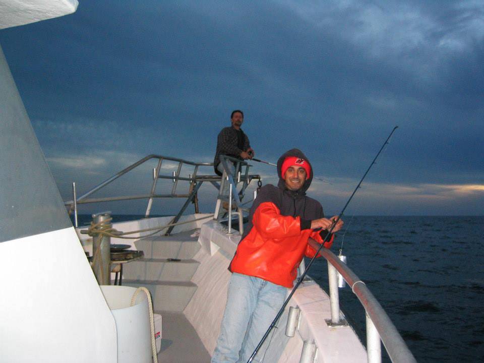 Two people enjoying fishing adventure in NJ