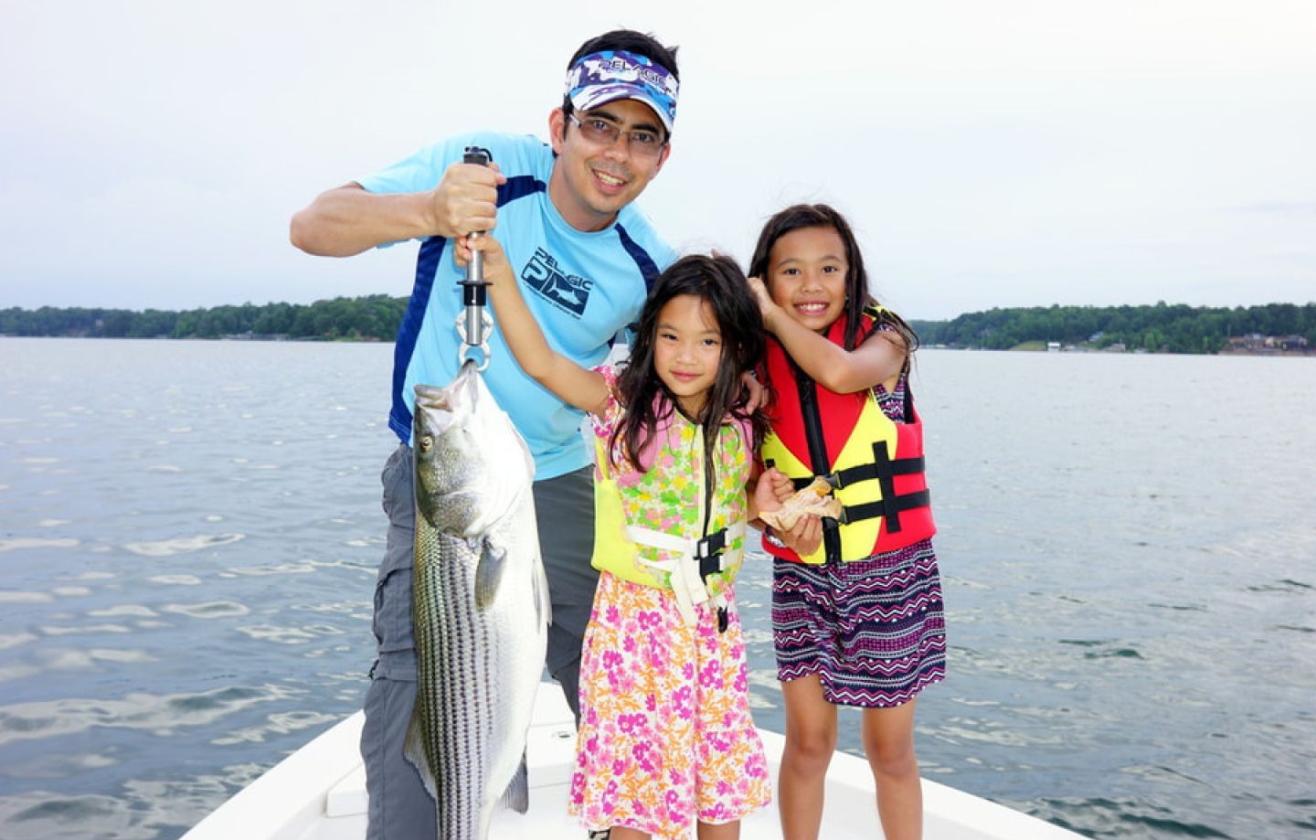 Striped bass fishing success in Kingston OK with fresh catch displayed on boat
