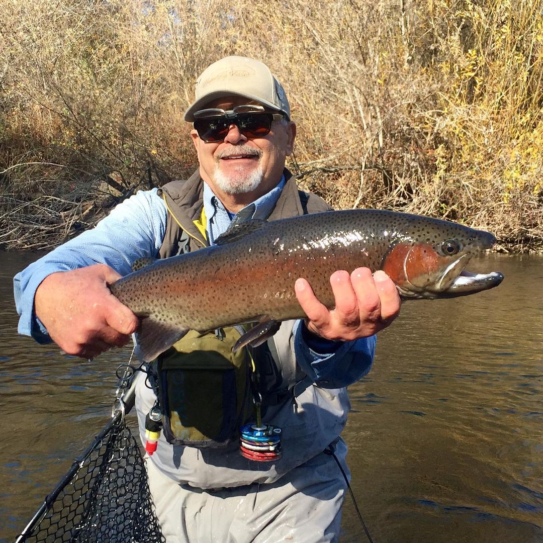 Fly fishing guide and angler on Kings River targeting trout in California's deepest canyon