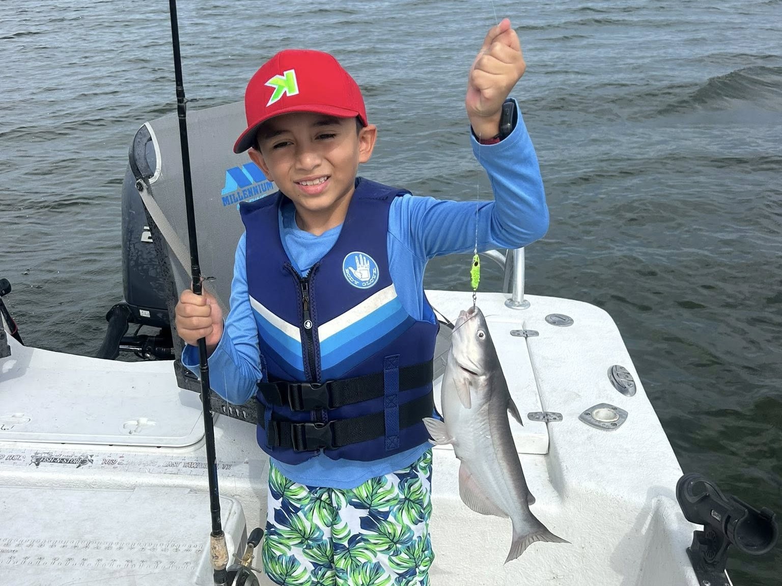 Family fishing trip on Lake Tawakoni with kids and guide on boat catching bass and catfish