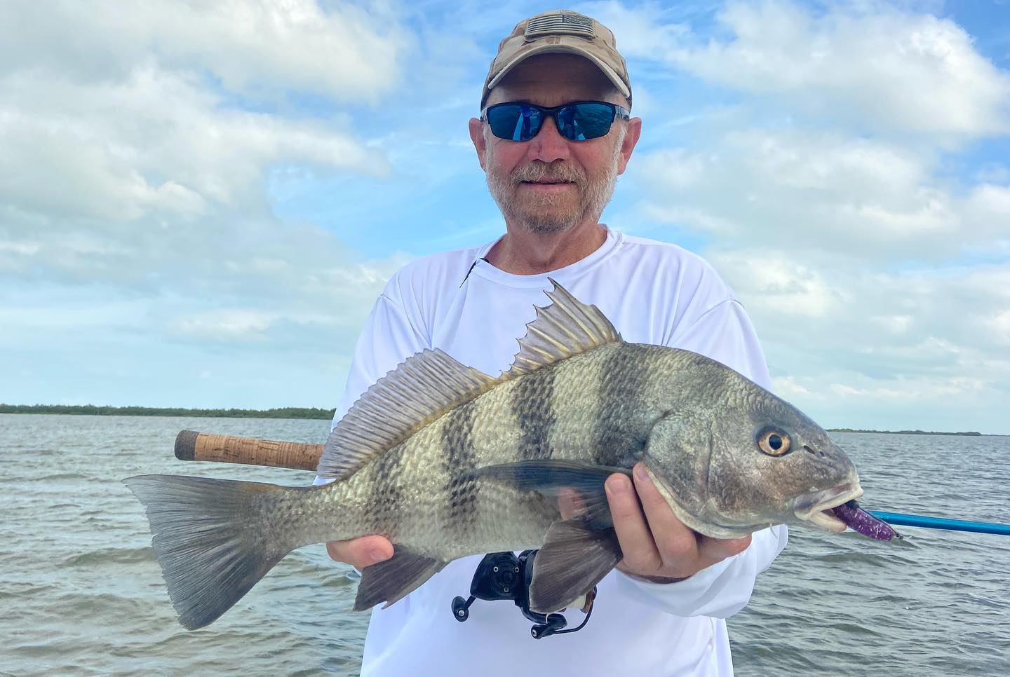 Angler with a big black drum fish catch in Orlando