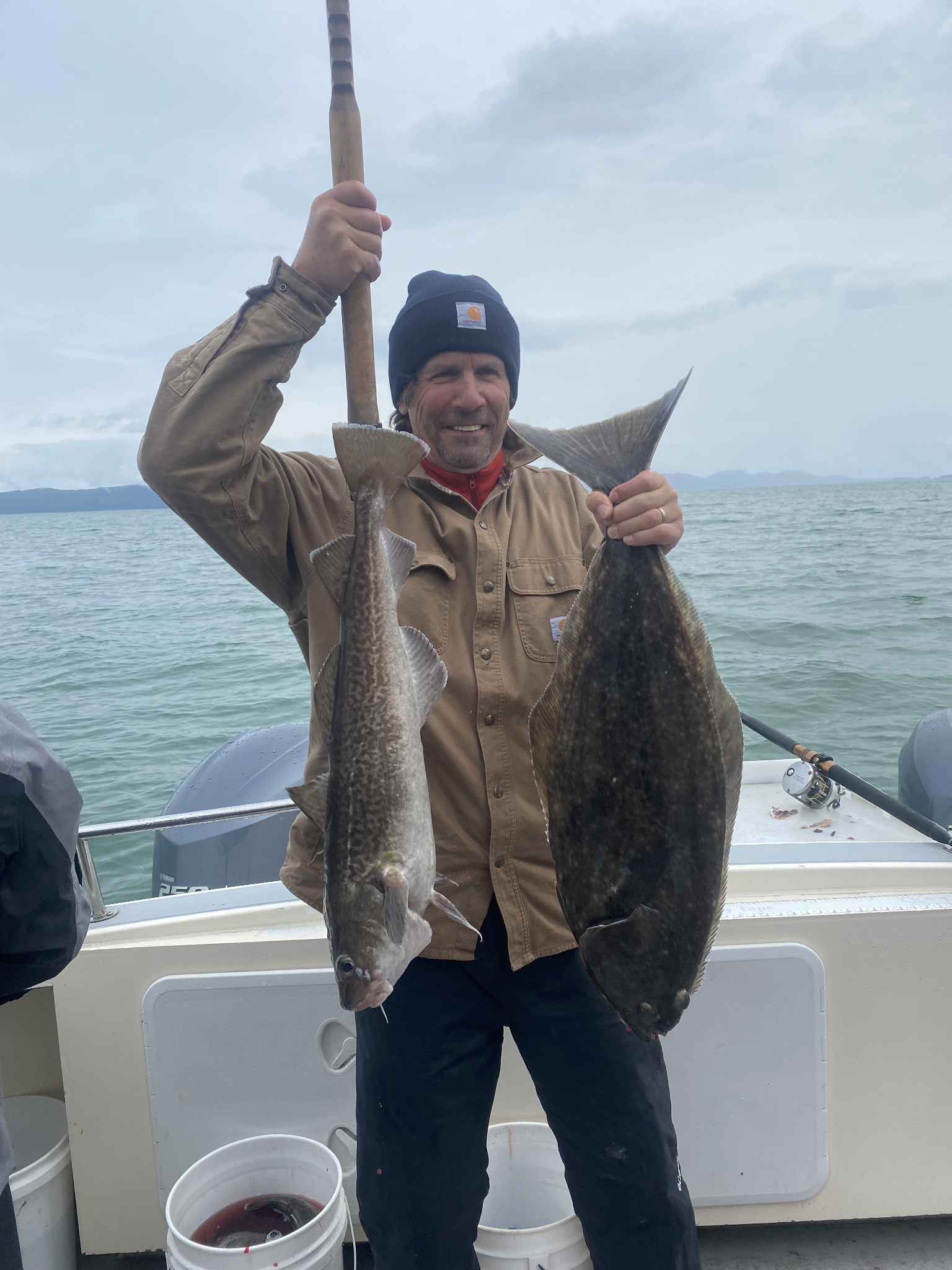 Pacific halibut and Atlantic cod catch displayed on fishing boat in Juneau Alaska