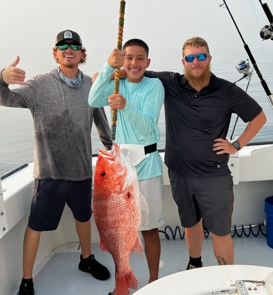 A group of 3 people fishing in Florida