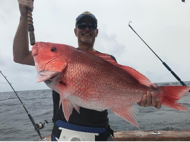 Angler posing with a 33-inch fish in Destin, Florida