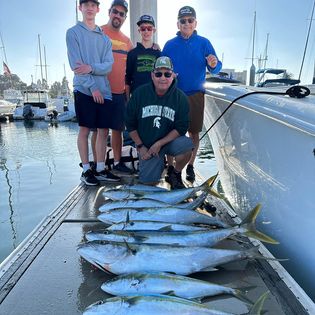 Five people fishing with two big fish caught in San Diego