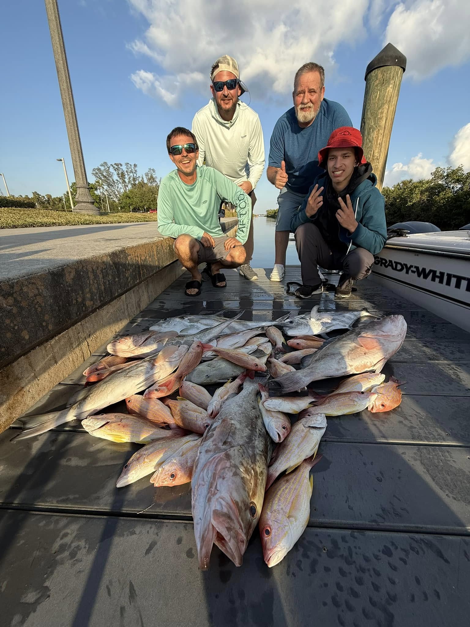 4 people fishing in FL with 5 fish