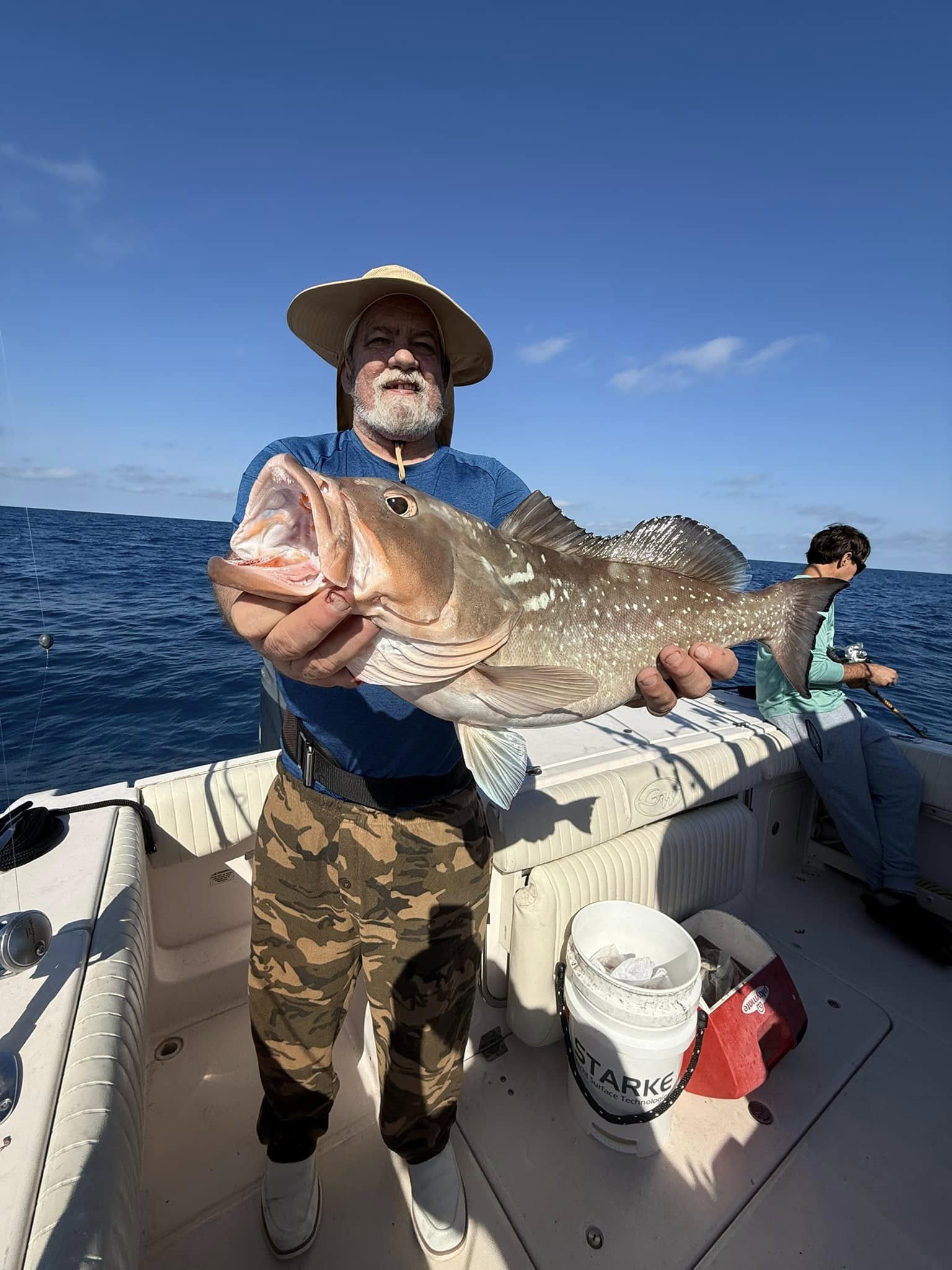 A person fishing at a scenic location in Cape Coral