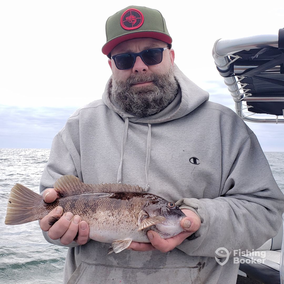 Angler with a 13-inch fish caught in NJ