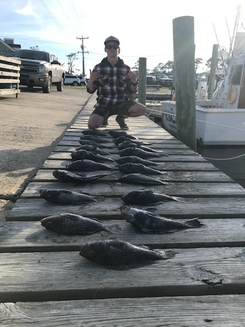 Angler with two big fish in Manteo