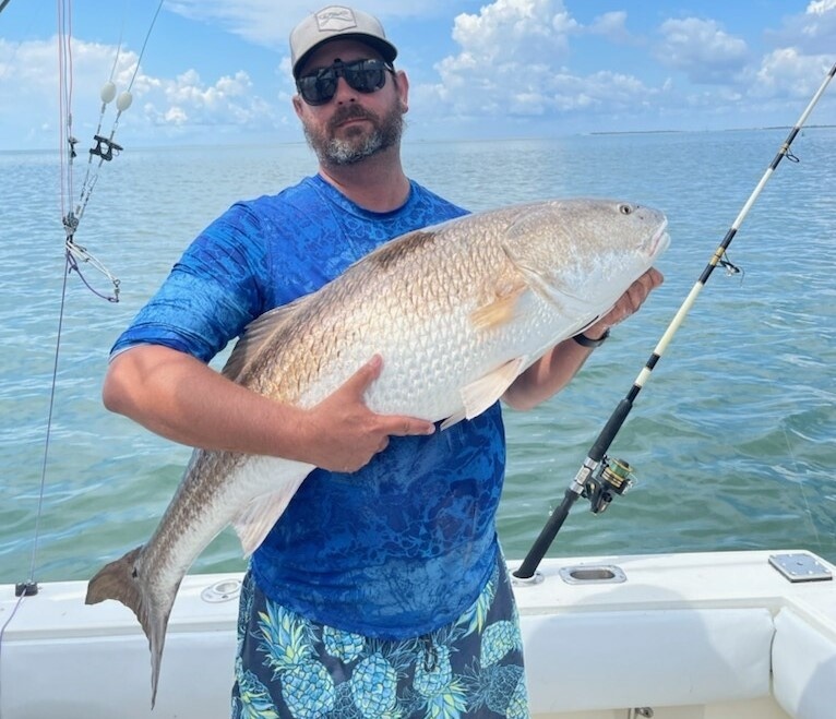 one person fishing in manteo