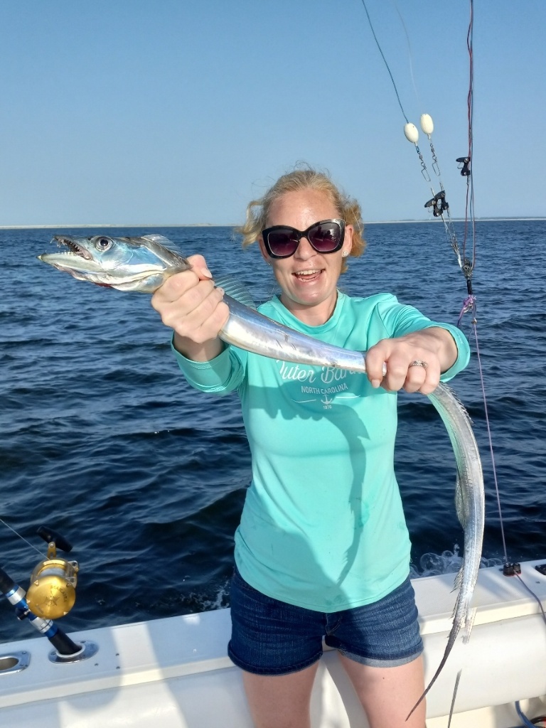 A person fishing in Manteo