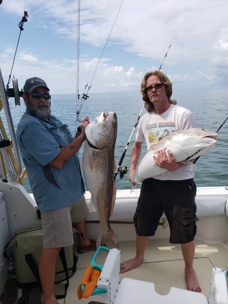 Two people fishing in Manteo