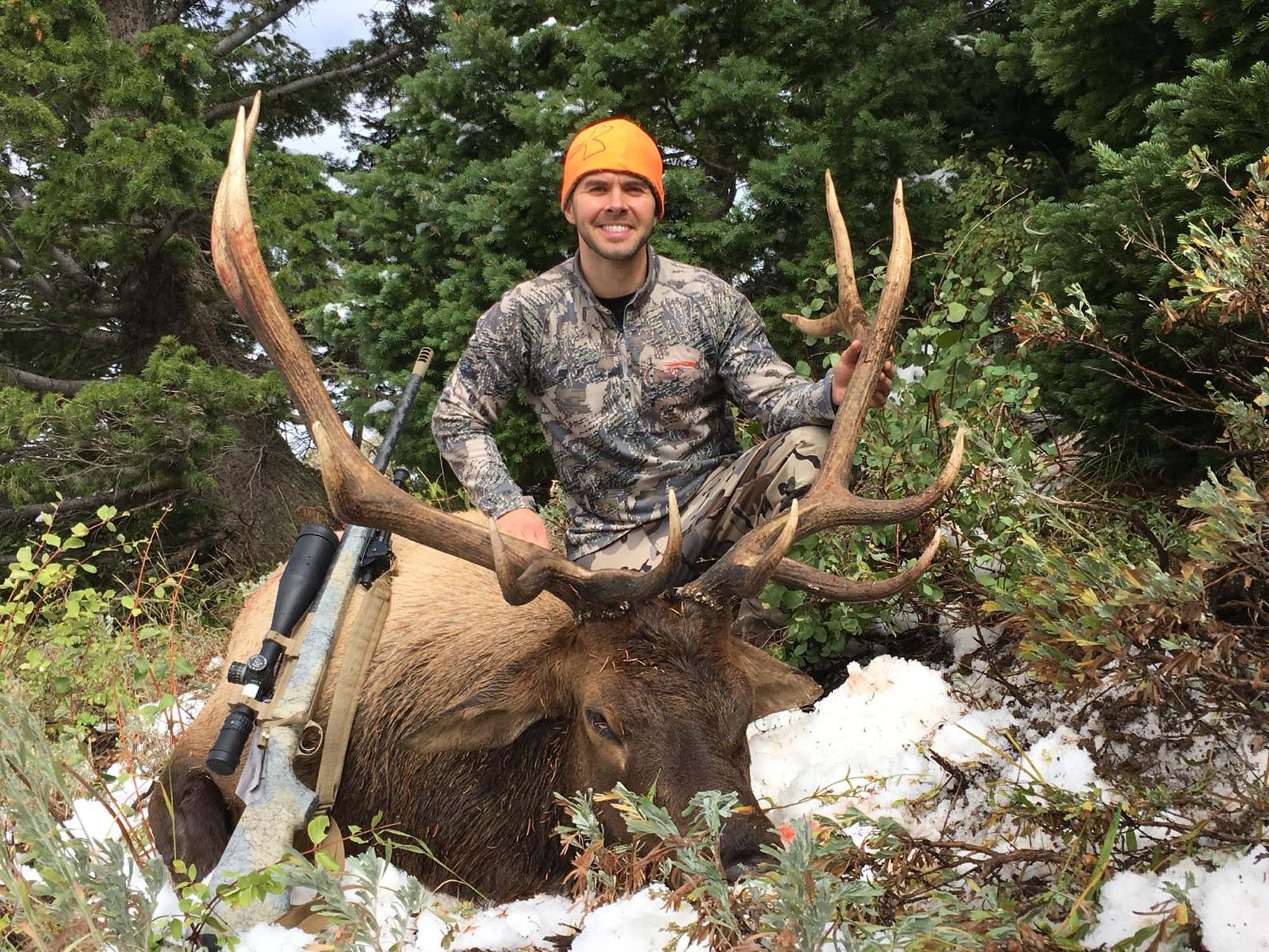 Wyoming moose hunt guide with hunter in wilderness habitat during archery or rifle season