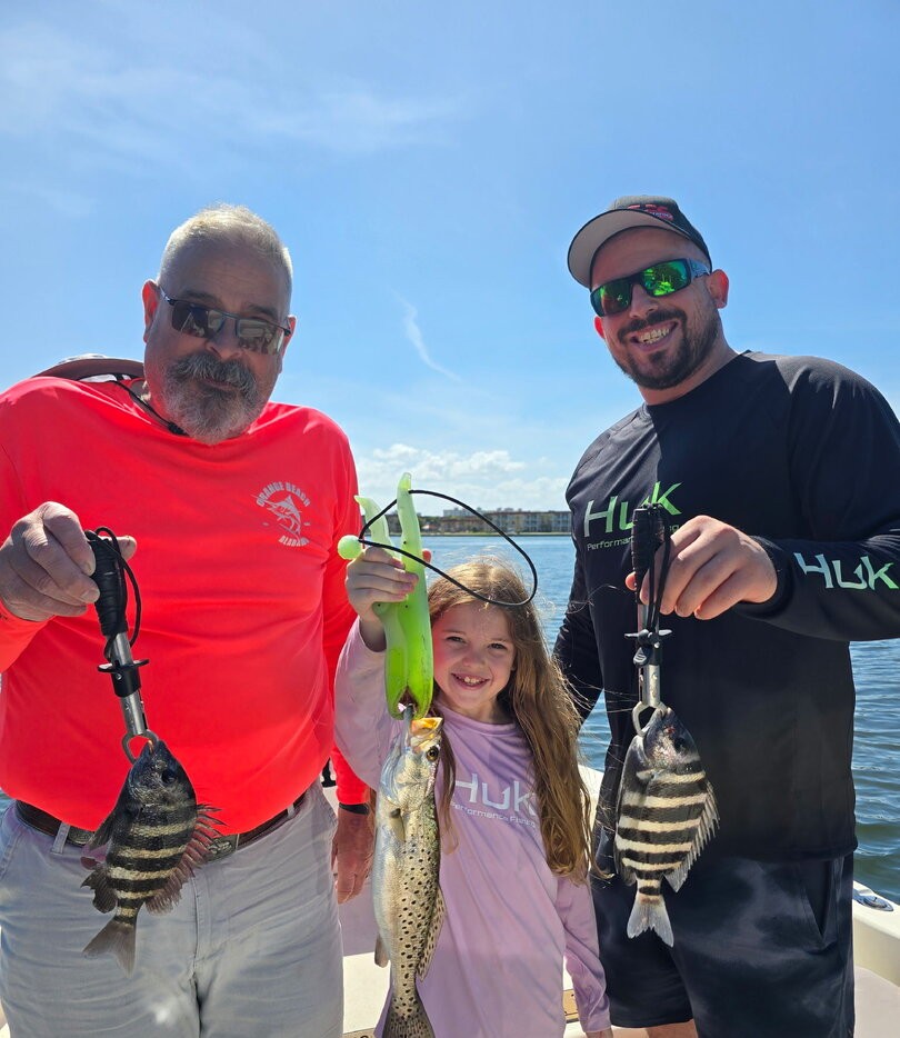 Successful fishing trip in St. Petersburg FL showing caught sheepshead and speckled trout