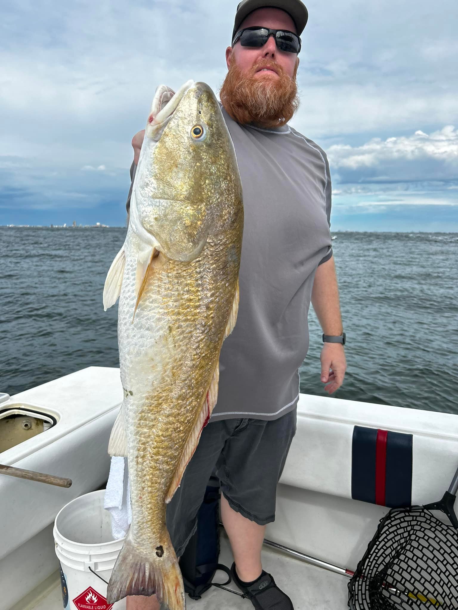 A lone fisherman reeling in a 33-inch catch in TX