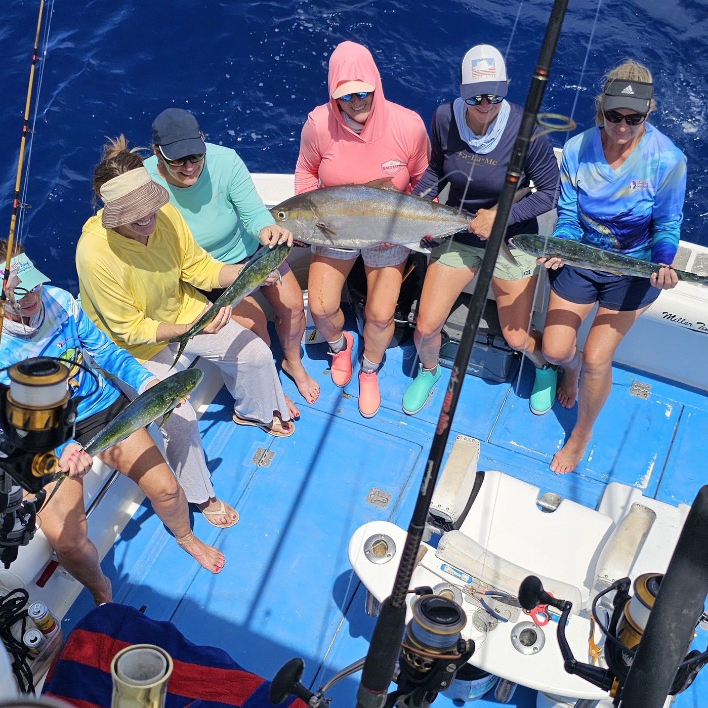Fishing charter in Islamorada FL displaying catch of Greater Amberjack and Mahi Mahi on boat deck