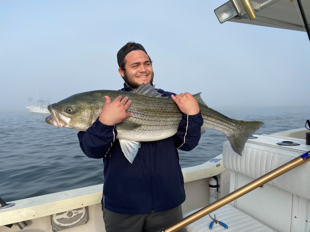A lone angler reeling in a 22-inch catch in Keyport