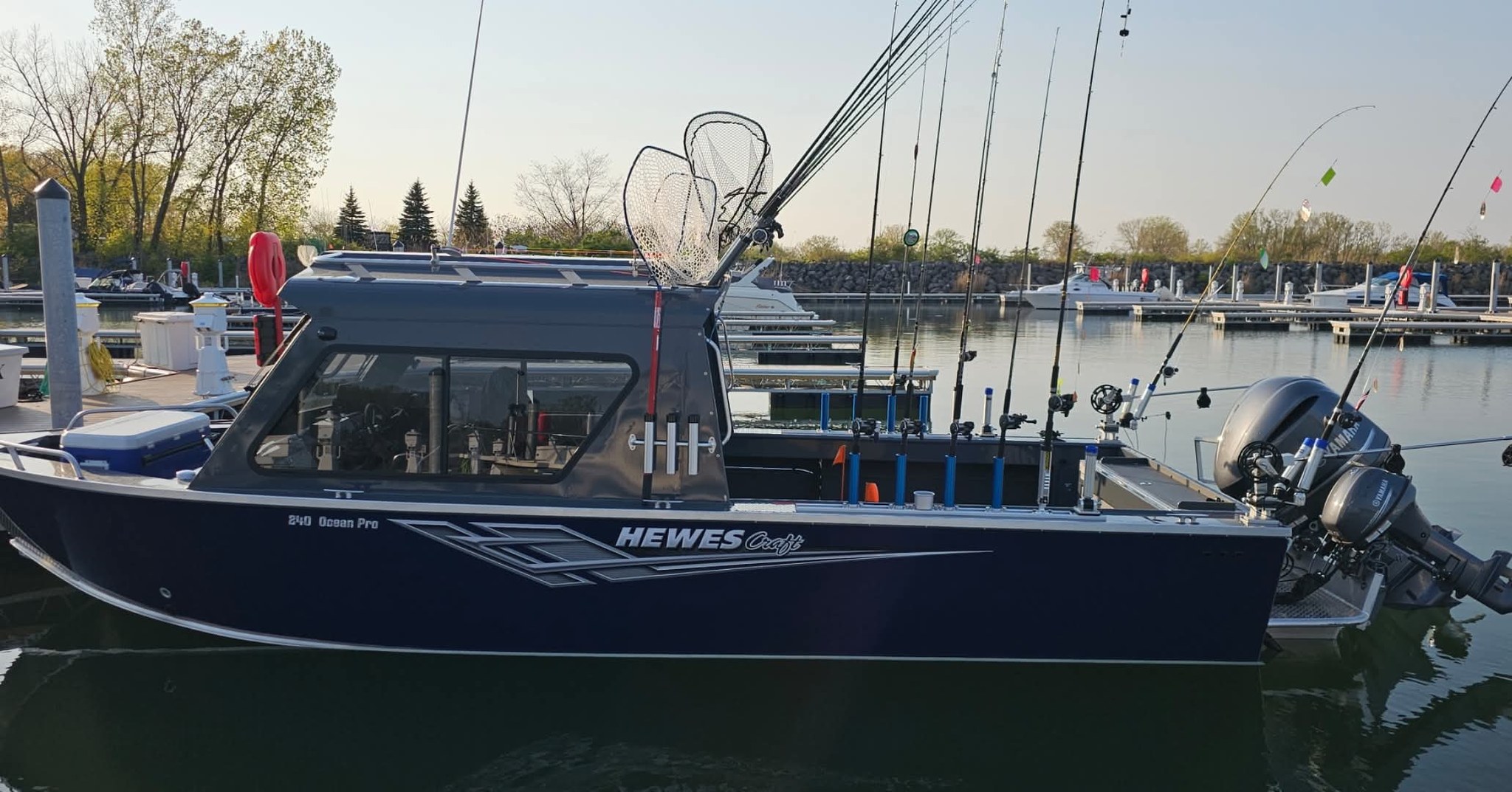 Hewes Ocean Pro fishing boat equipped with multiple fishing rods and nets docked at Erie PA marina