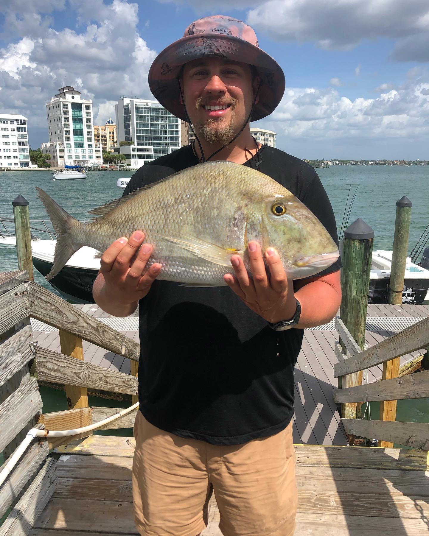 A lone angler fishing in Sarasota, with a SEO-friendly focus on the 'best' and 'great' fishing experience.