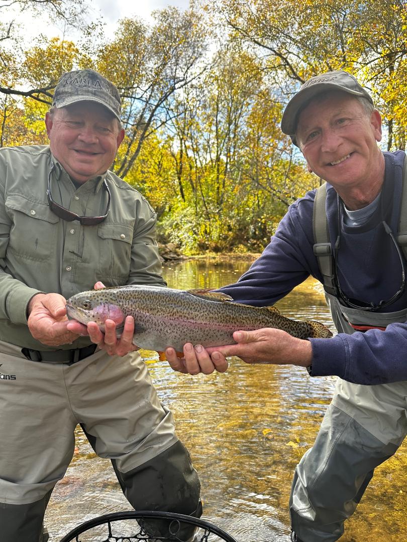 A fisherman holding a 17-inch Rainbow Trout in NC