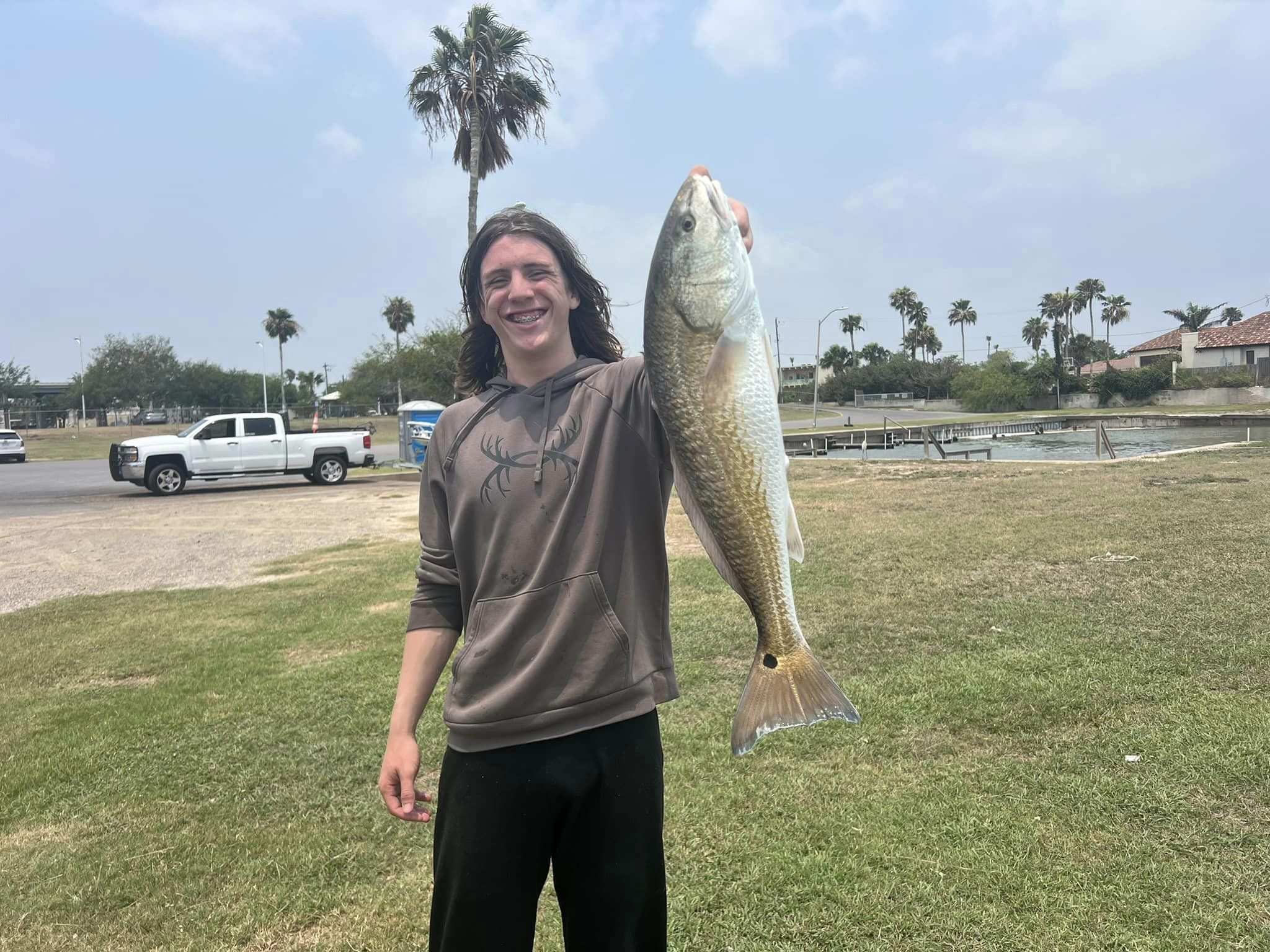 Angler holding a 29-inch redfish in TX