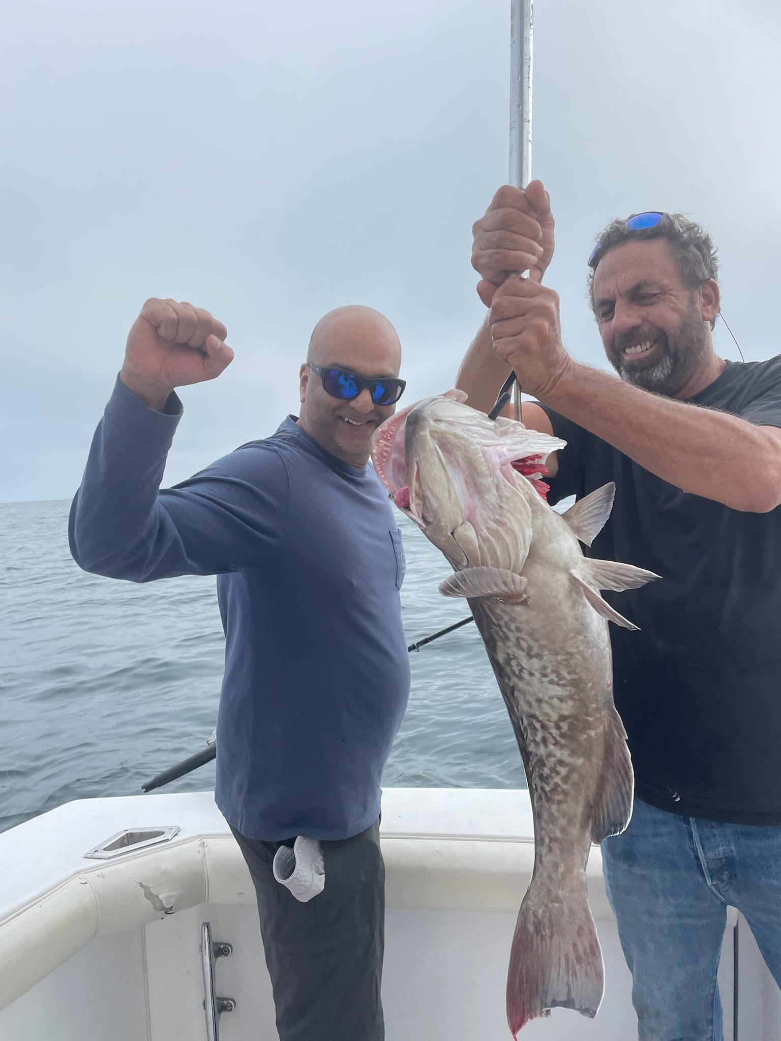 Two anglers catch a big fish in Tierra Verde