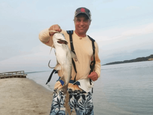 Angler with a 21-inch fish on the shore of Saint Simons Island