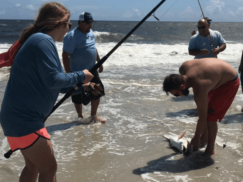 Two people exploring the beach on Saint Simons Island