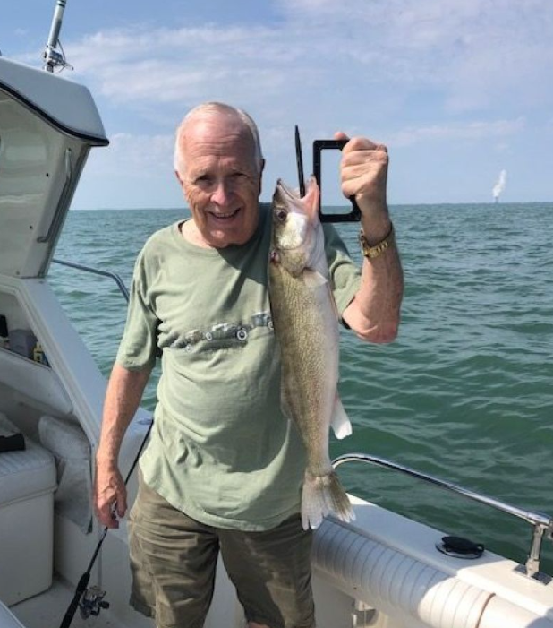 A lone angler fishing in Port Clinton