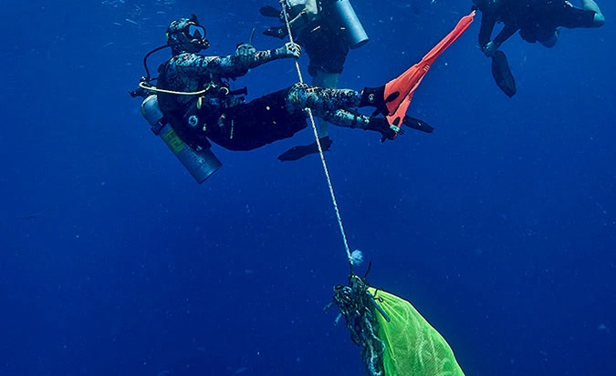 Divers removing marine debris during PADI SSI Dive Against Debris specialty course Florida Keys