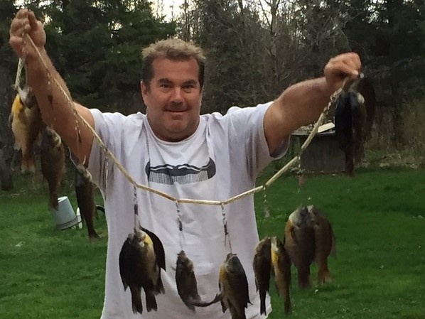 4 freshly caught fish in a scenic location