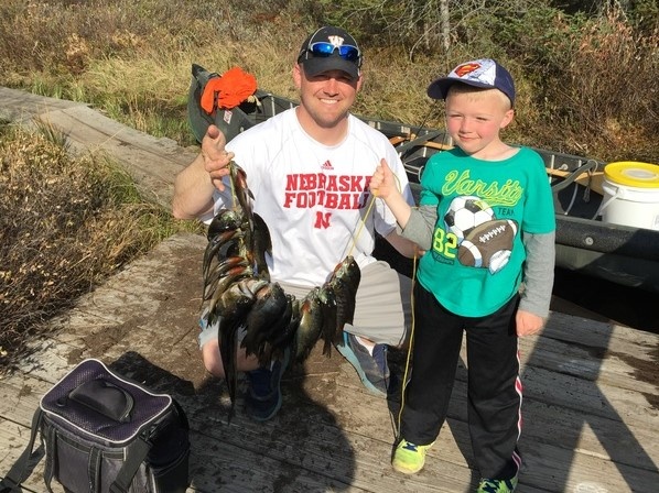 Two people enjoying a fishing trip in WI