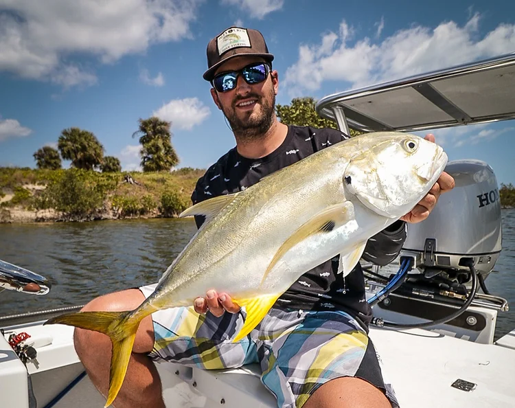 Horse-Eye Jack fish caught by two people on Merritt Island