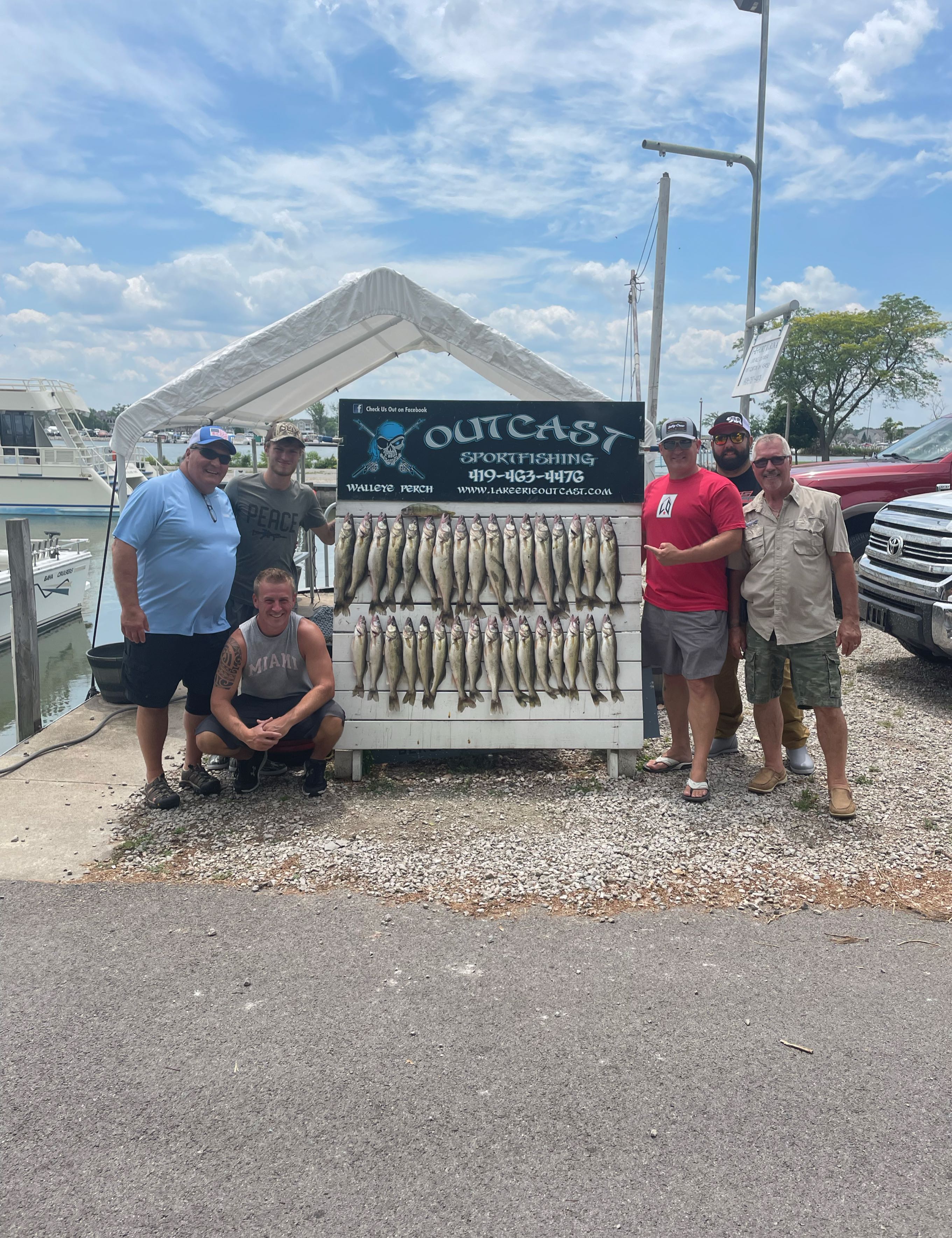 Group of 6 people fishing in Port Clinton