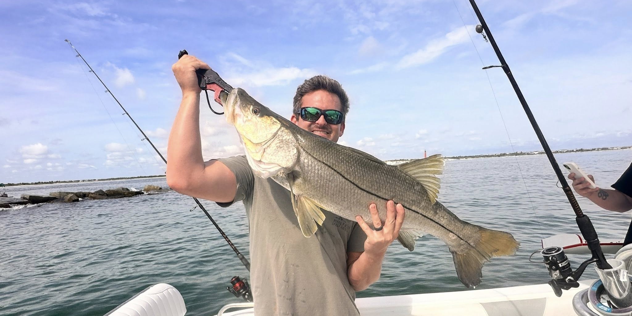 Family inshore fishing trip at Ponce Inlet with kids catching fish from charter boat