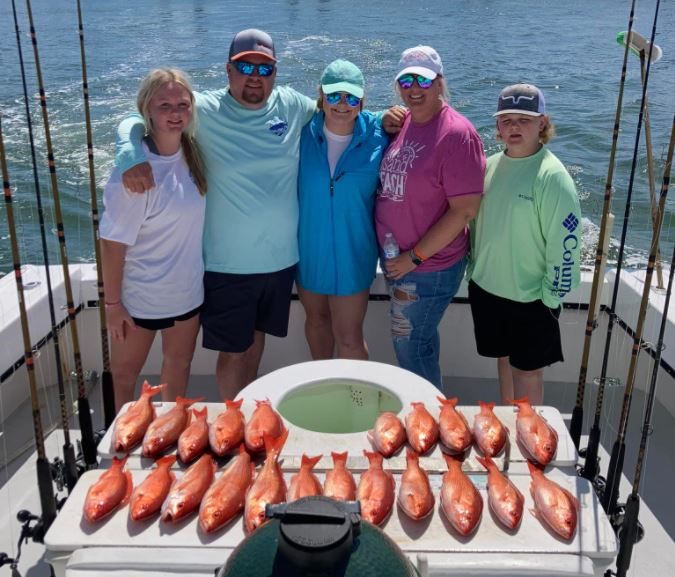 5 people enjoying a day at the beach in Orange Beach