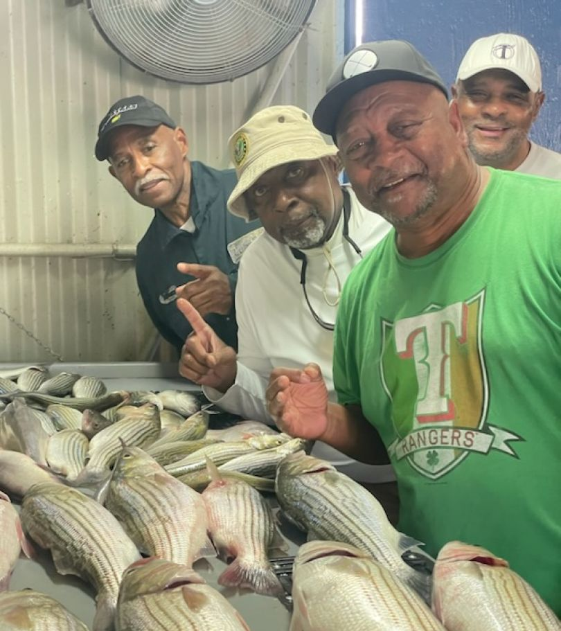 Four people fishing at Pottsboro