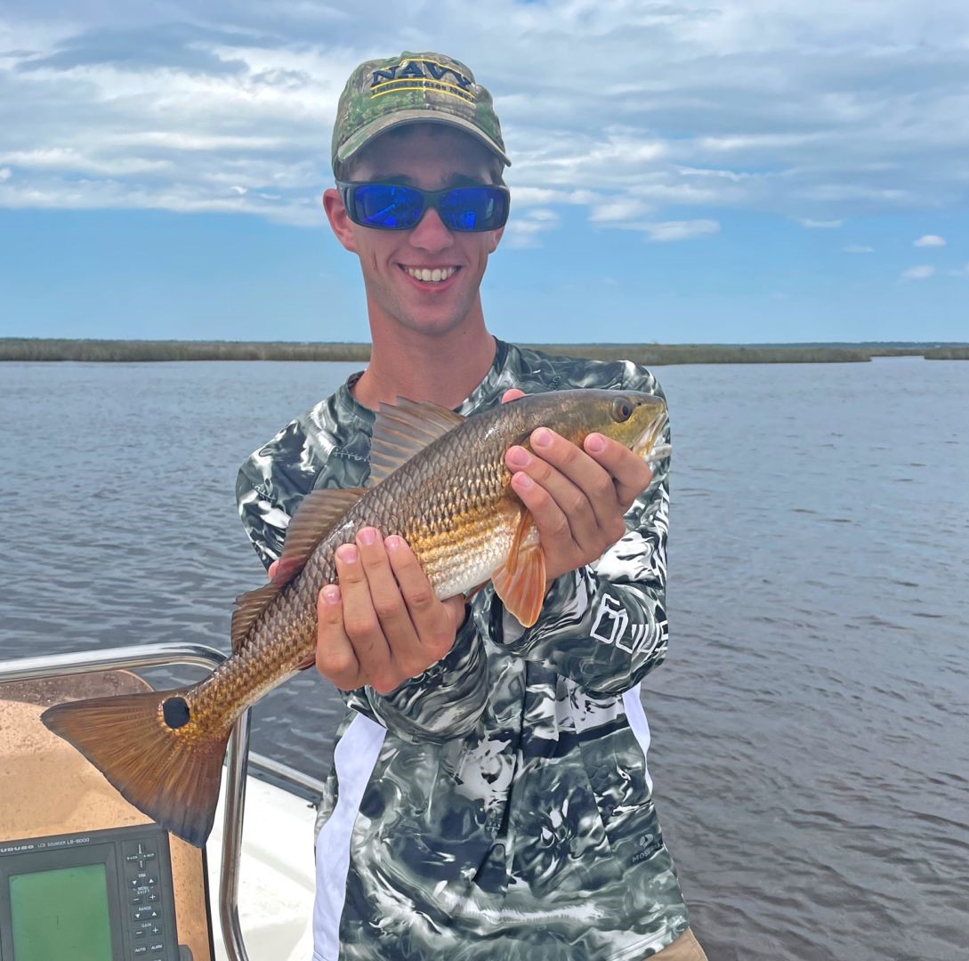 Angler catches a fish in Panama City