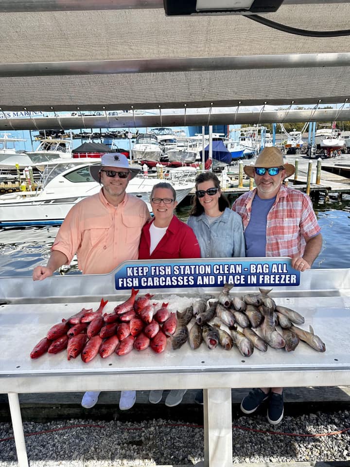 Four people enjoying a fishing trip at Shalimar