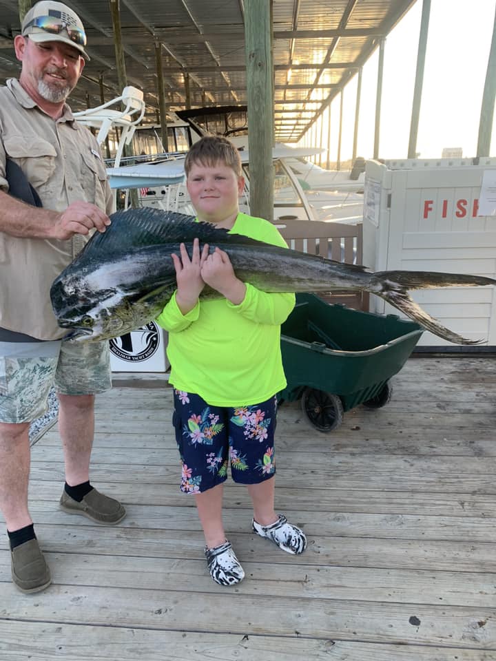 A couple fishing in Florida with a big 38-inch catch