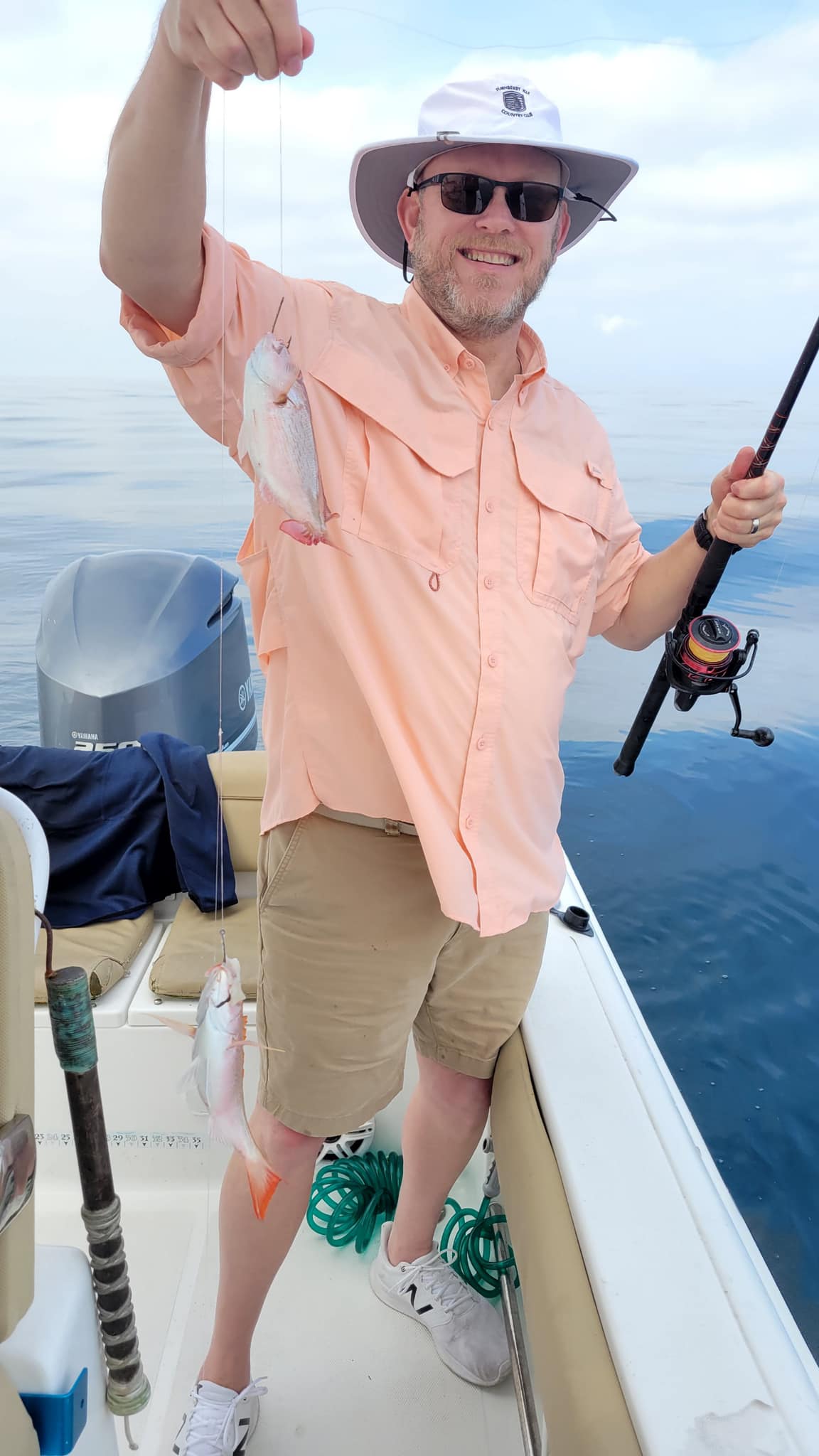 Two small fishing rods and tackle in a beautiful outdoor setting
