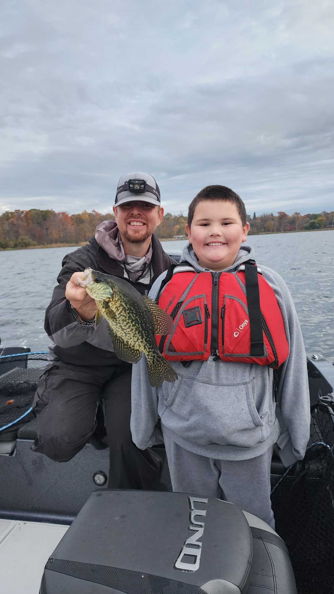 Successful crappie fishing trip on lake in Breezy Point MN with freshly caught fish