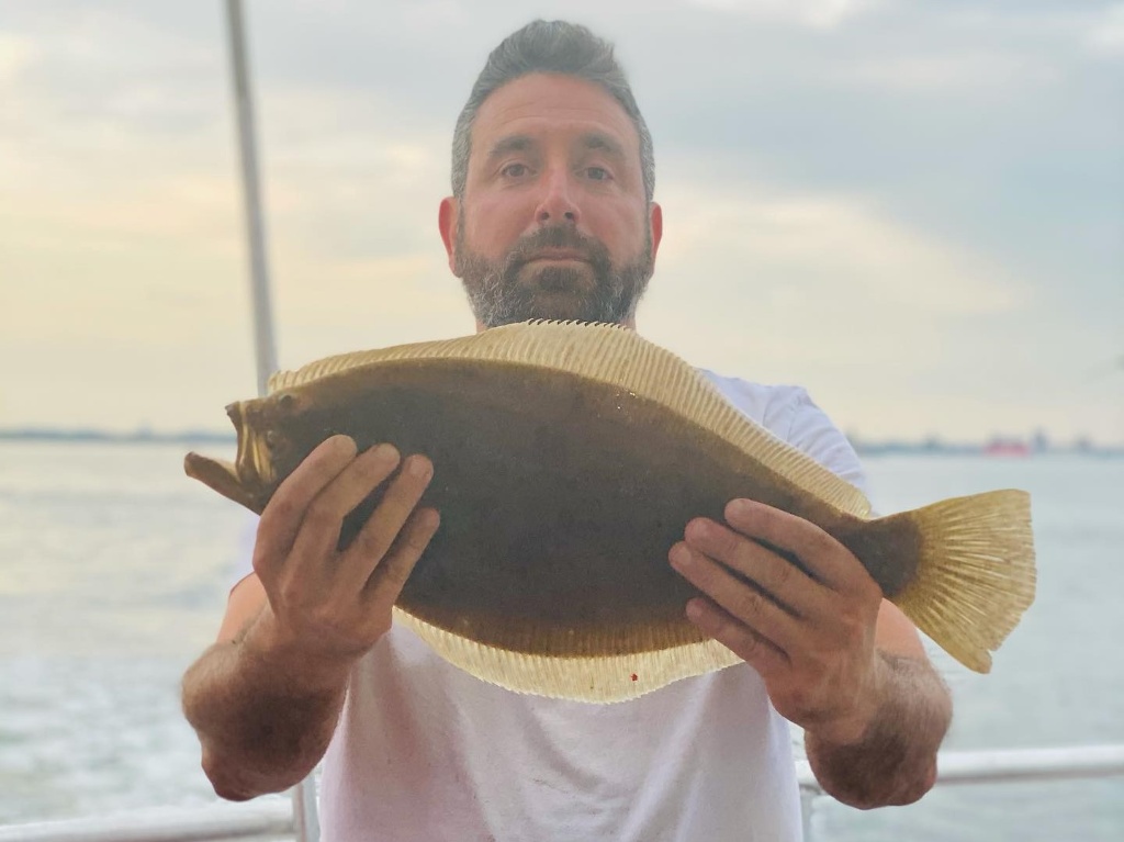 Angler holding a fishing rod in Keyport