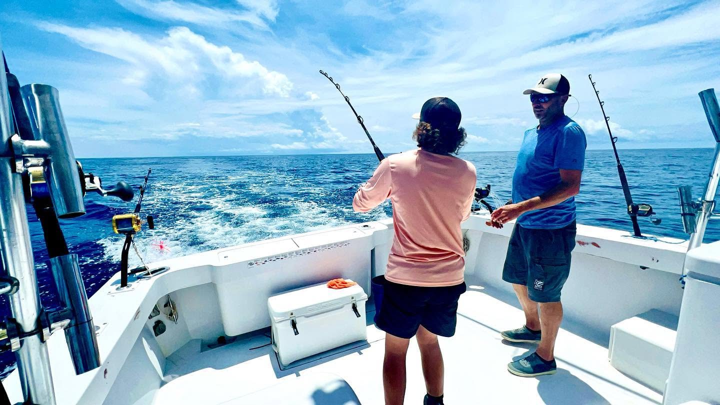 Deep sea fishing from boat deck at Wrightsville Beach NC with fishing rods set up