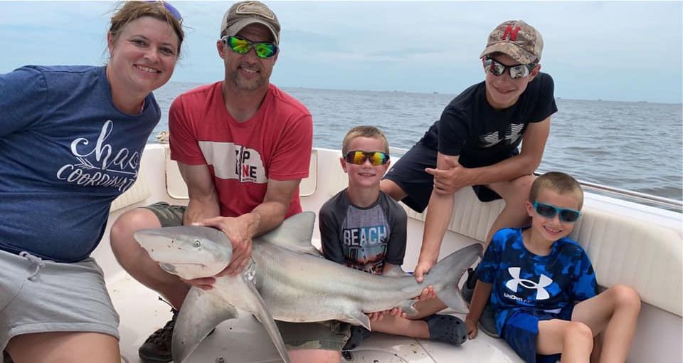 A group of 5 people fishing in Texas
