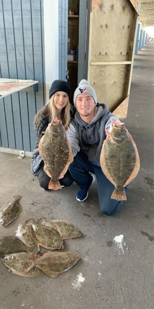 Two summer flounder, a fishing scene in Texas