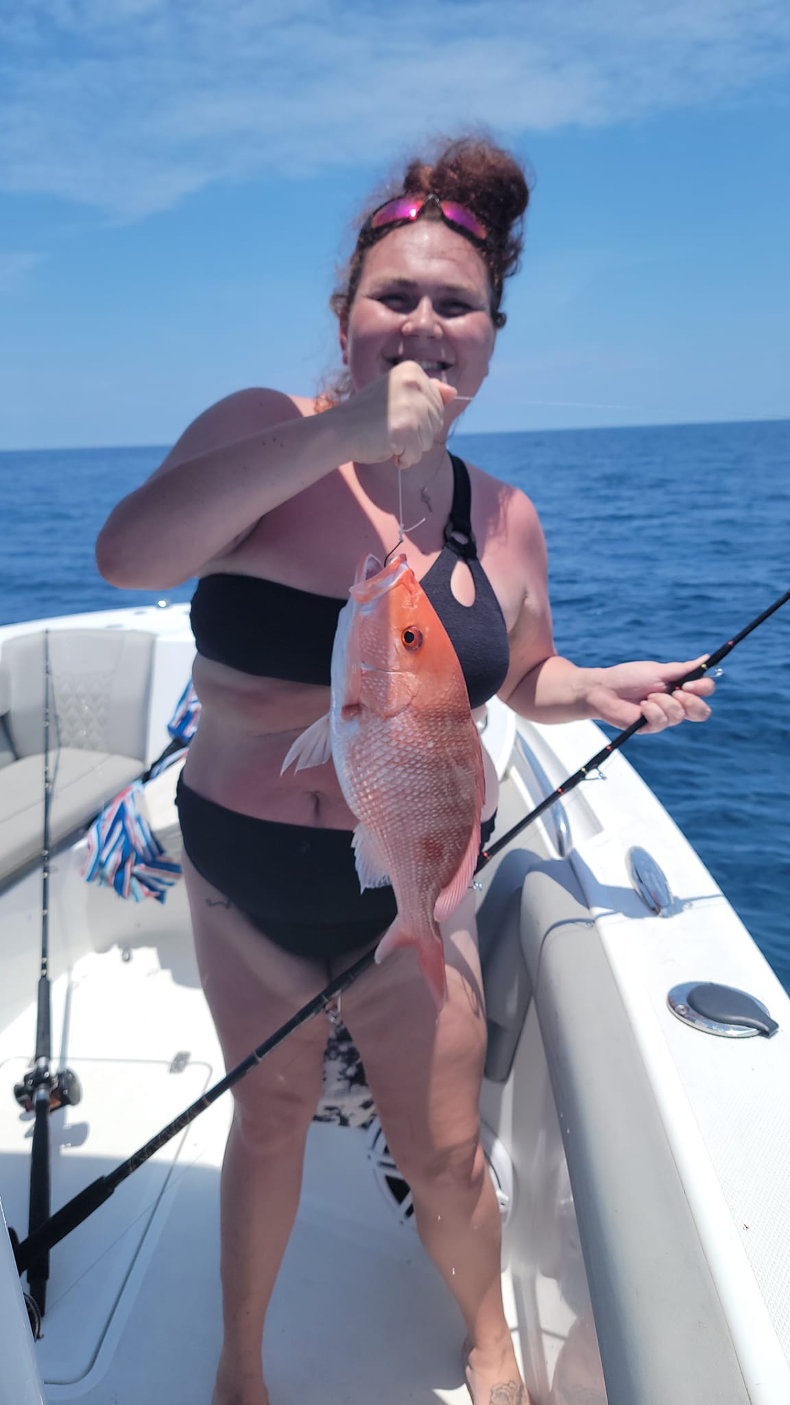 Angler holding a 14-inch fish in Jacksonville