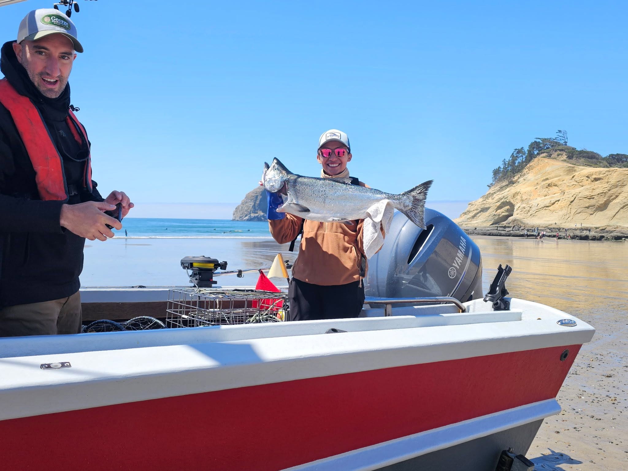 Chinook salmon caught fishing in Pacific City OR with boat on beach