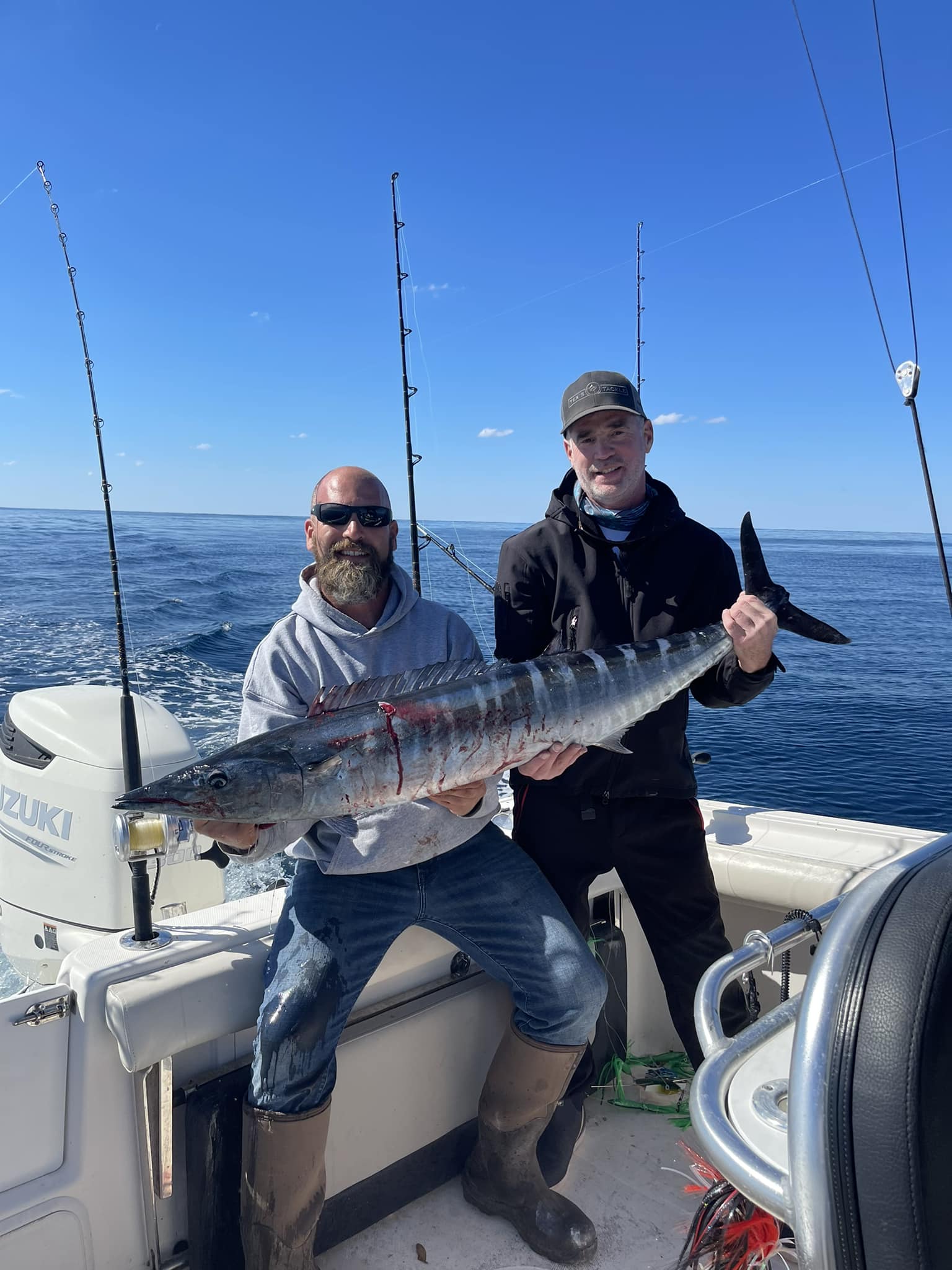 Wahoo fish caught by two people fishing on Oak Island