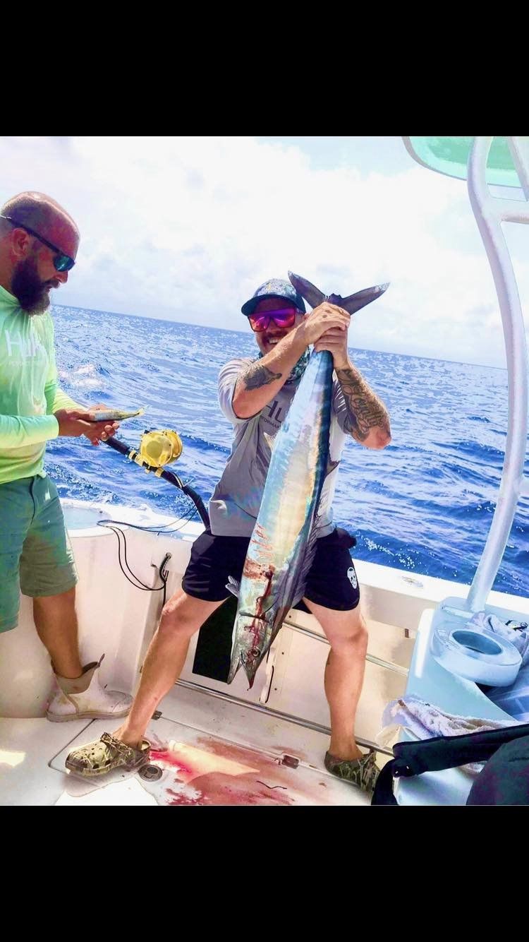 A fisherman catching a 30-inch fish on Oak Island